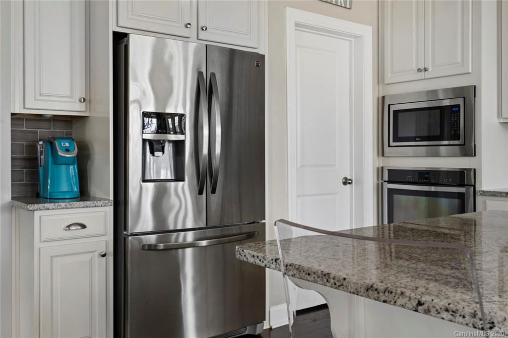 274 Helton Lane Fort Mill, SC 29708 - Photo 24 of 44 a kitchen with stainless steel appliances granite countertop a refrigerator and a stove top oven