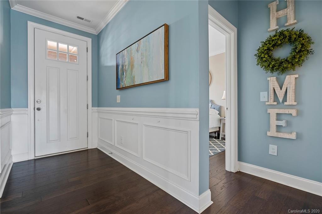 274 Helton Lane Fort Mill, SC 29708 - Photo 4 of 44 an entryway with wooden floor and cabinet
