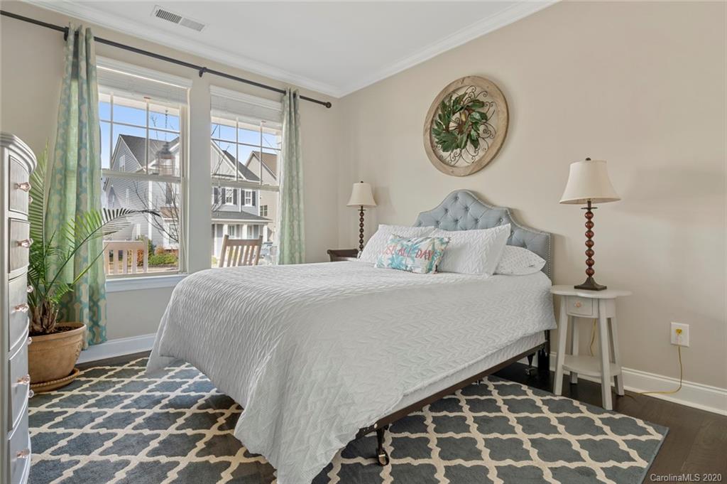 274 Helton Lane Fort Mill, SC 29708 - Photo 7 of 44 a bedroom with a bed and a lamp next to a window