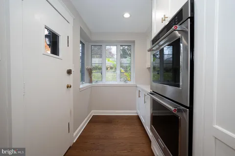 a bathroom with a bathtub and a window
