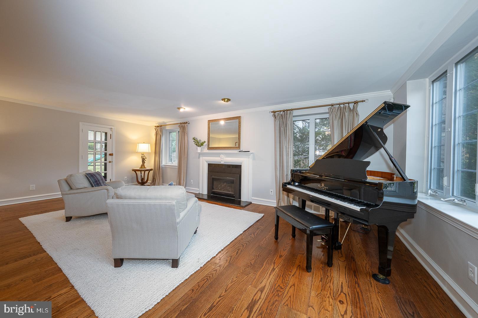 346 Winding Way Merion Station, PA 19066 - Photo 19 of 51 a living room with furniture and a fireplace