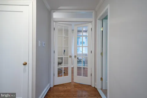 a view of bedroom with a bed and wooden floor