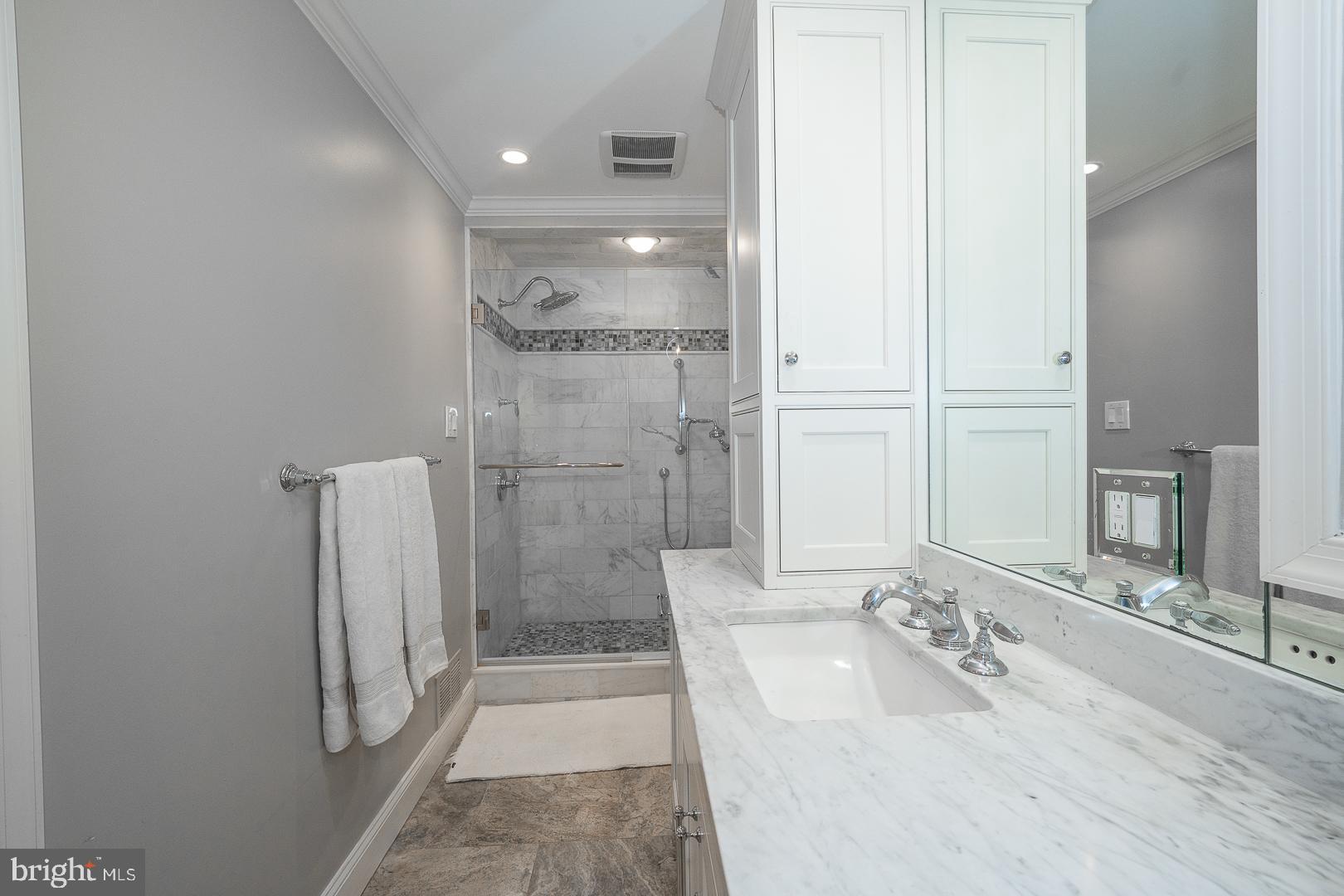 346 Winding Way Merion Station, PA 19066 - Photo 27 of 51 a bathroom with a granite countertop sink a shower and a mirror