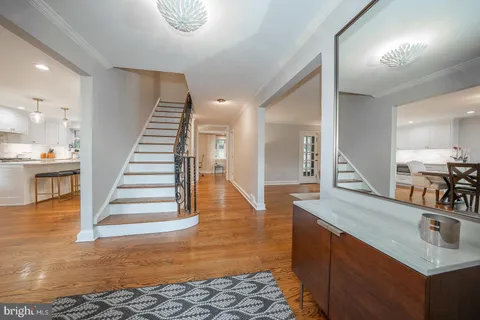 a view of a kitchen with sink and natural light