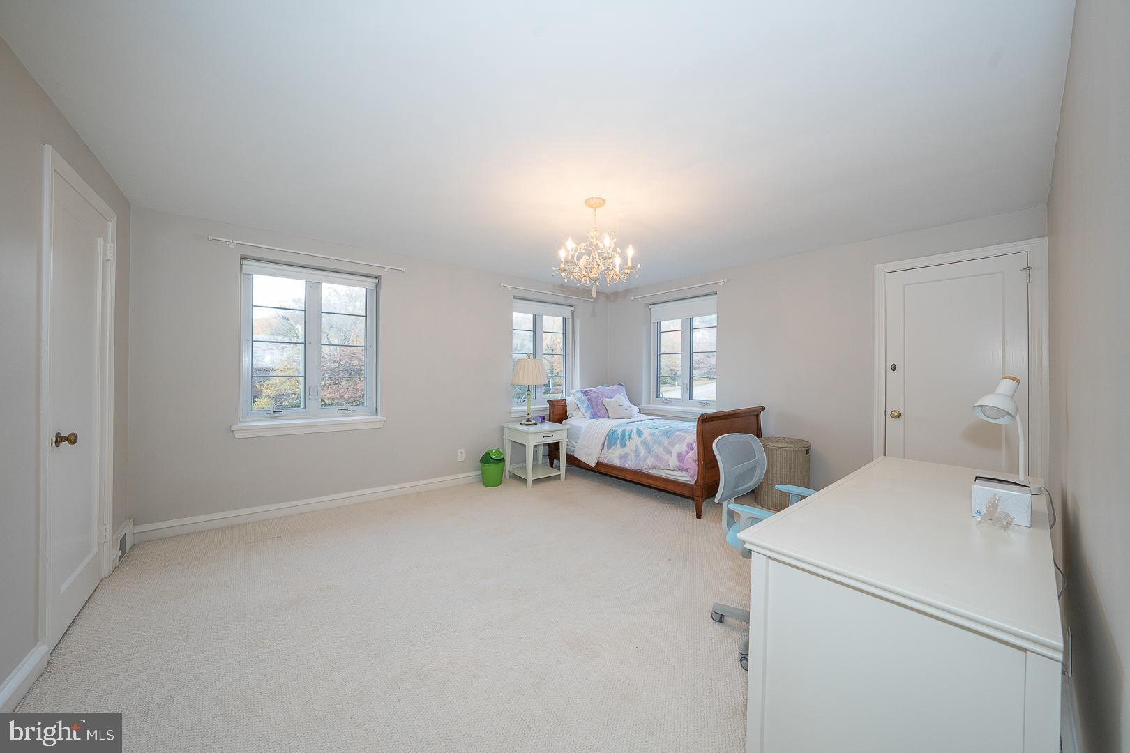 346 Winding Way Merion Station, PA 19066 - Photo 37 of 51 a living room with furniture and a chandelier