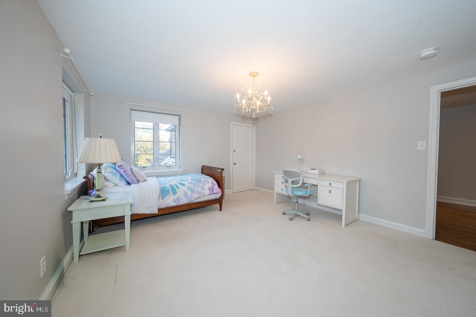 346 Winding Way Merion Station, PA 19066 - Photo 38 of 51 a bedroom with furniture and a chandelier