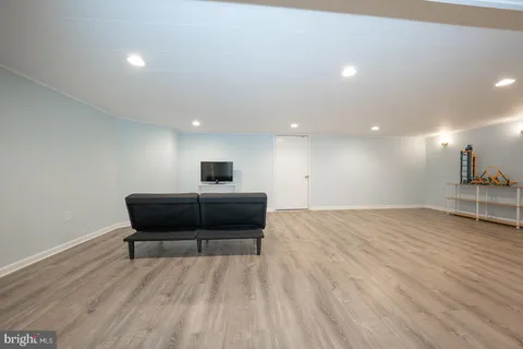 a view of a room with an empty space and a window