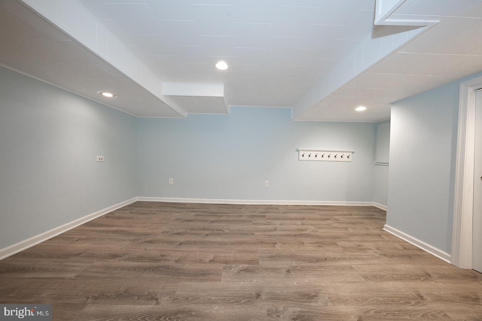 346 Winding Way Merion Station, PA 19066 - Photo 42 of 51 a view of an empty room with wooden floor and a window
