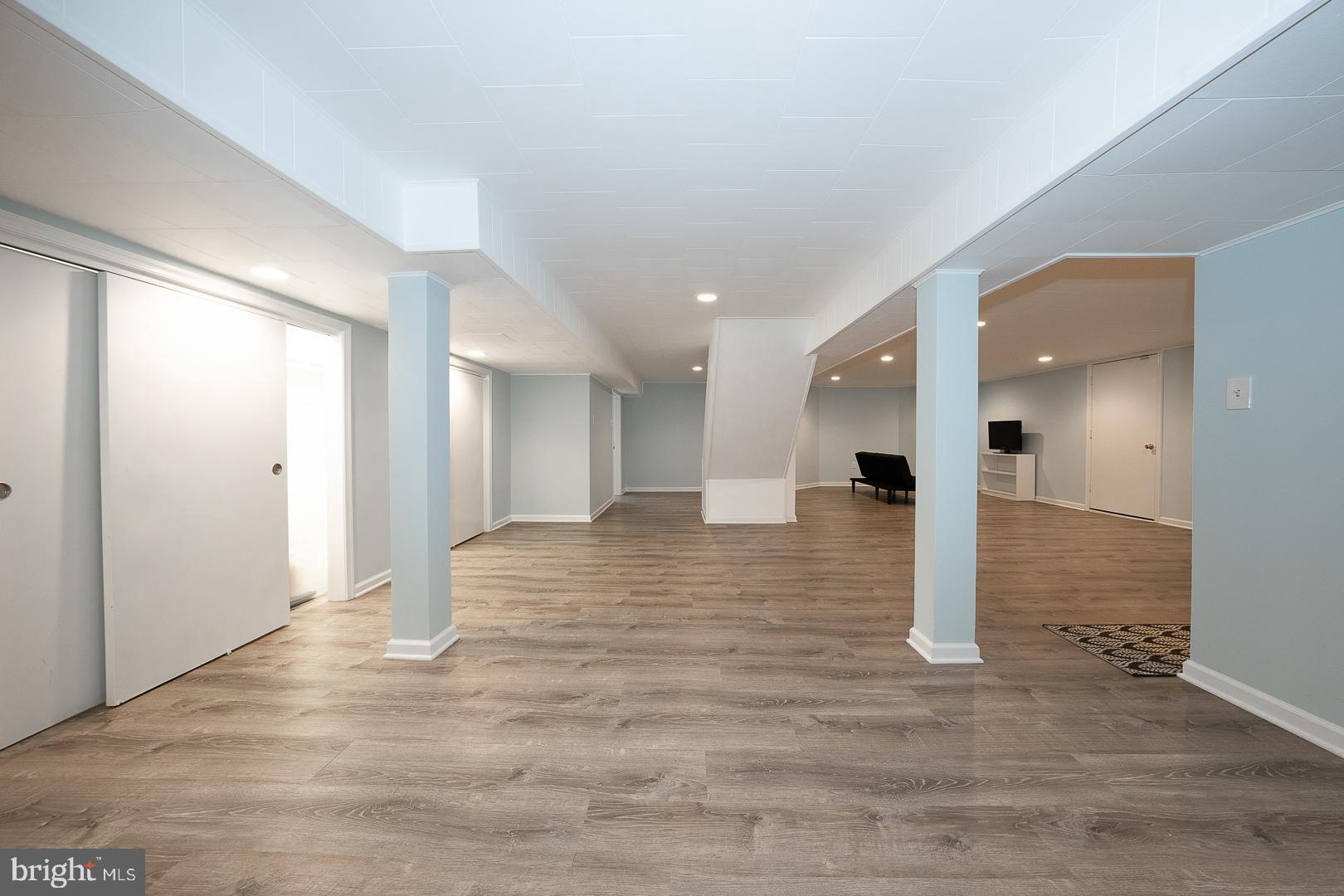 346 Winding Way Merion Station, PA 19066 - Photo 43 of 51 a view of a big room with wooden floor and staircase