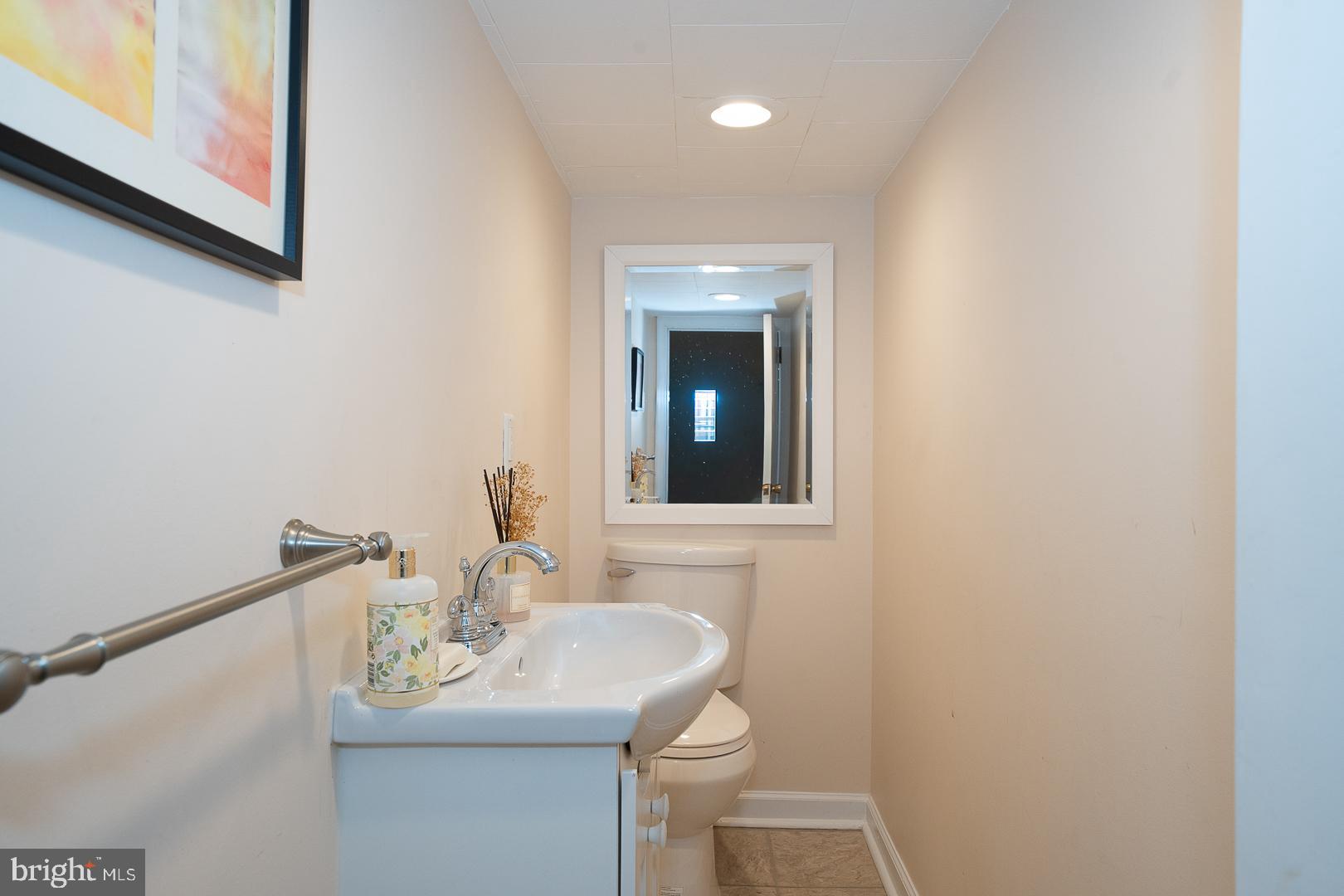 346 Winding Way Merion Station, PA 19066 - Photo 46 of 51 a bathroom with a sink a toilet and mirror