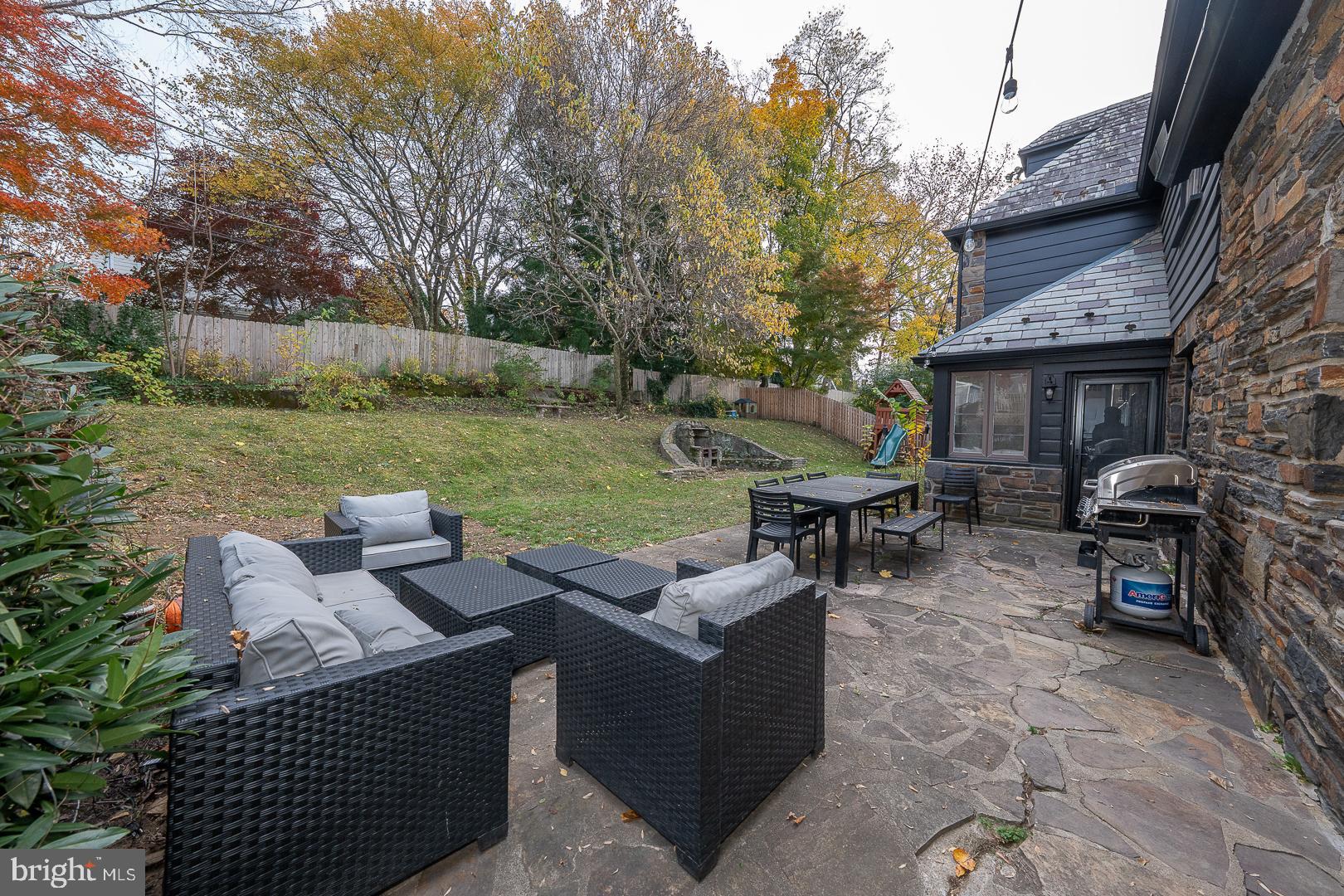 346 Winding Way Merion Station, PA 19066 - Photo 48 of 51 a view of a patio with couches chairs and a fire pit
