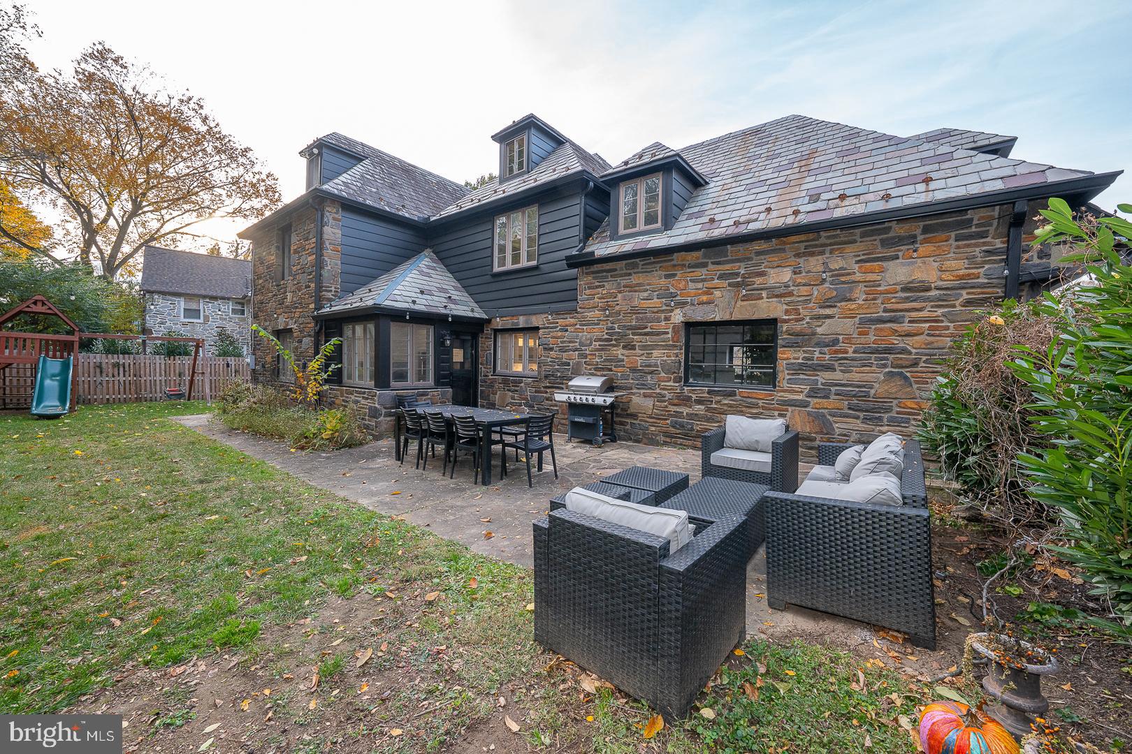 346 Winding Way Merion Station, PA 19066 - Photo 49 of 51 a view of a patio with couches chairs and a fire pit