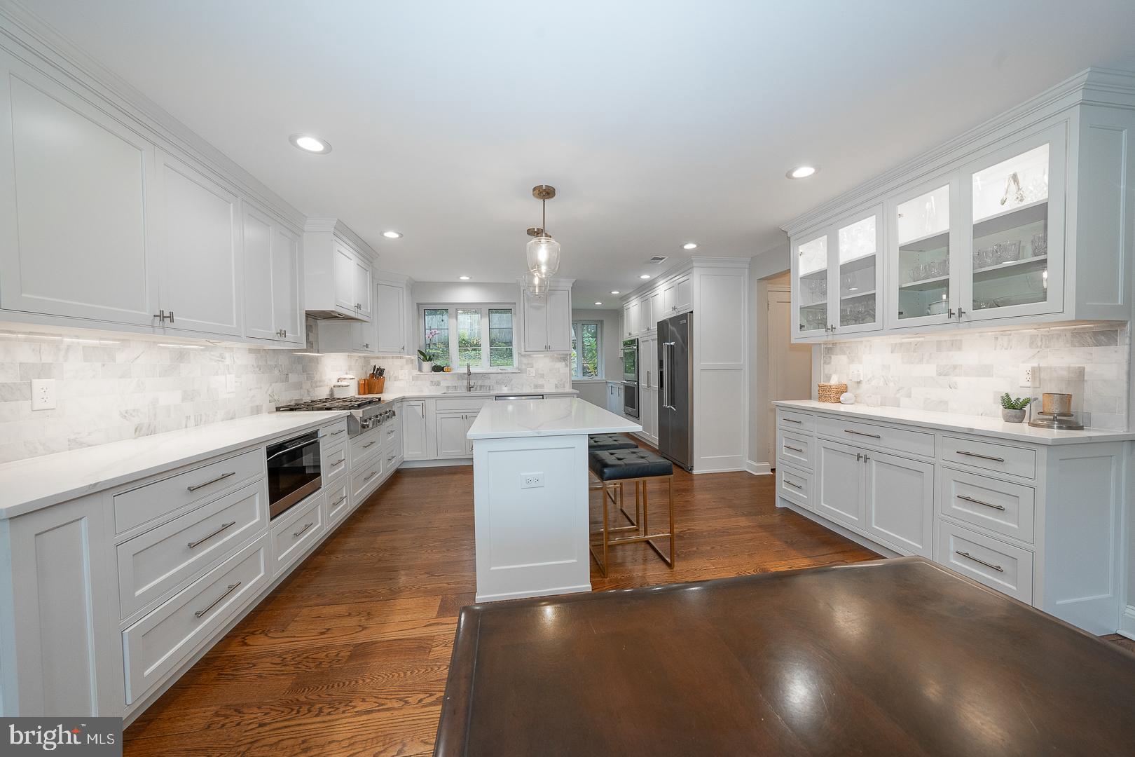 346 Winding Way Merion Station, PA 19066 - Photo 6 of 51 a large kitchen with a large counter top stainless steel appliances and cabinets