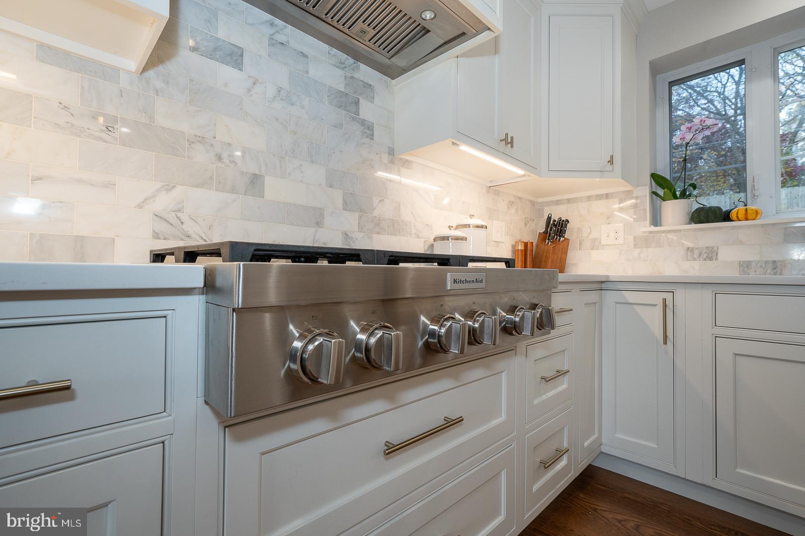 346 Winding Way Merion Station, PA 19066 - Photo 10 of 51 a kitchen with white cabinets and window