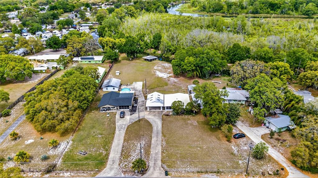 34618 South Haines Creek Road Leesburg, FL 34788 - Photo 12 of 41 an aerial view of a house with a yard basket ball court and outdoor seating