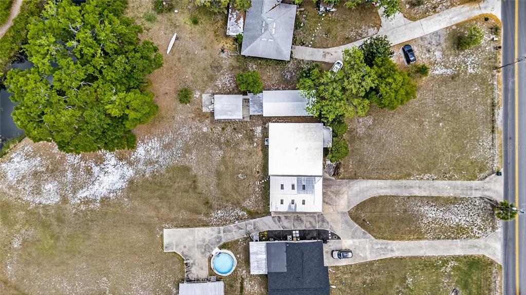 34618 South Haines Creek Road Leesburg, FL 34788 - Photo 14 of 41 an aerial view of residential houses with outdoor space