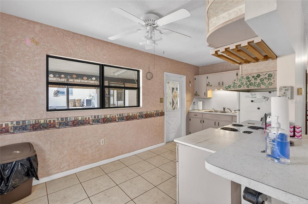 34618 South Haines Creek Road Leesburg, FL 34788 - Photo 22 of 41 a kitchen with a sink appliances and cabinets