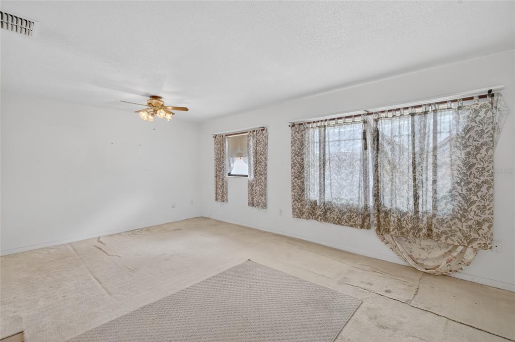 34618 South Haines Creek Road Leesburg, FL 34788 - Photo 23 of 41 a view of an empty room with a window