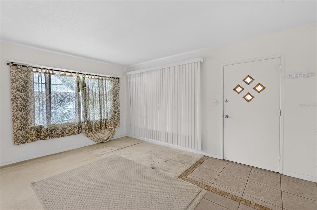 34618 South Haines Creek Road Leesburg, FL 34788 - Photo 27 of 41 a view of an empty room with a window