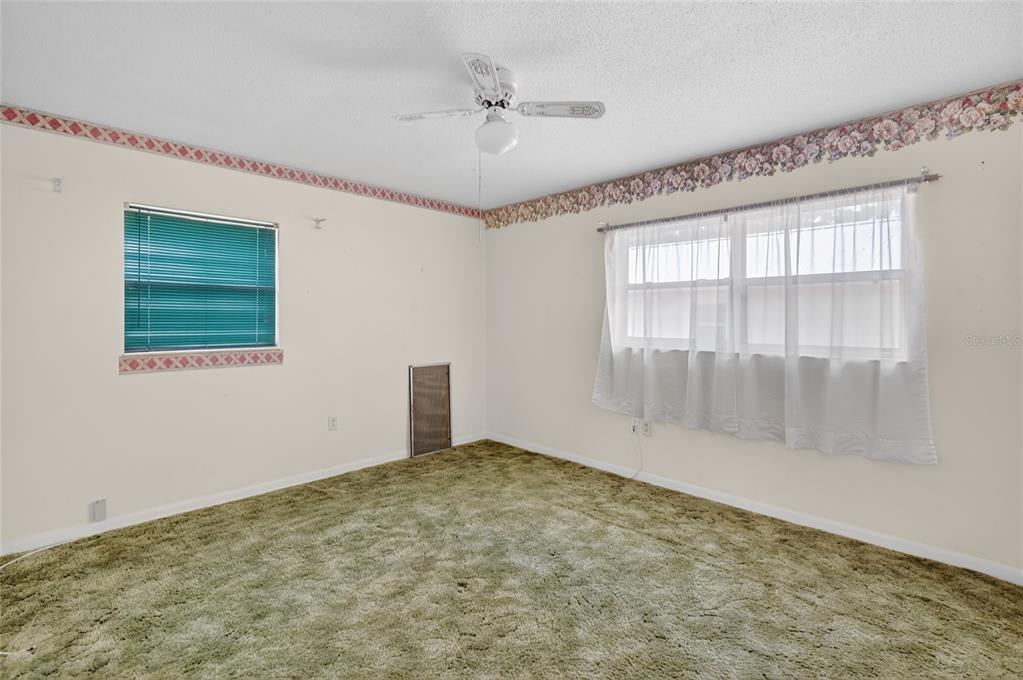 34618 South Haines Creek Road Leesburg, FL 34788 - Photo 29 of 41 a view of an empty room with a window