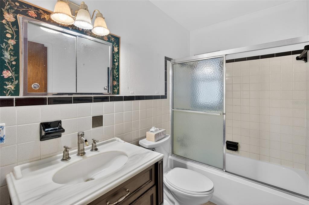 34618 South Haines Creek Road Leesburg, FL 34788 - Photo 31 of 41 a bathroom with a sink toilet and shower