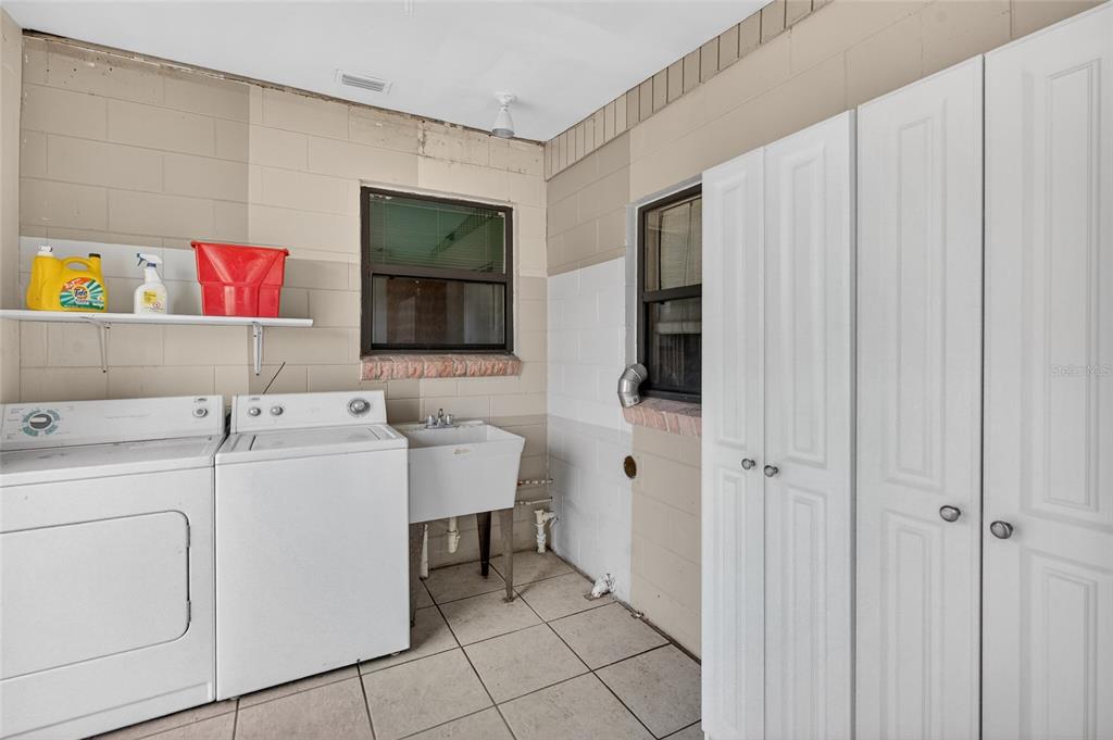 34618 South Haines Creek Road Leesburg, FL 34788 - Photo 40 of 41 a utility room with dryer and washer