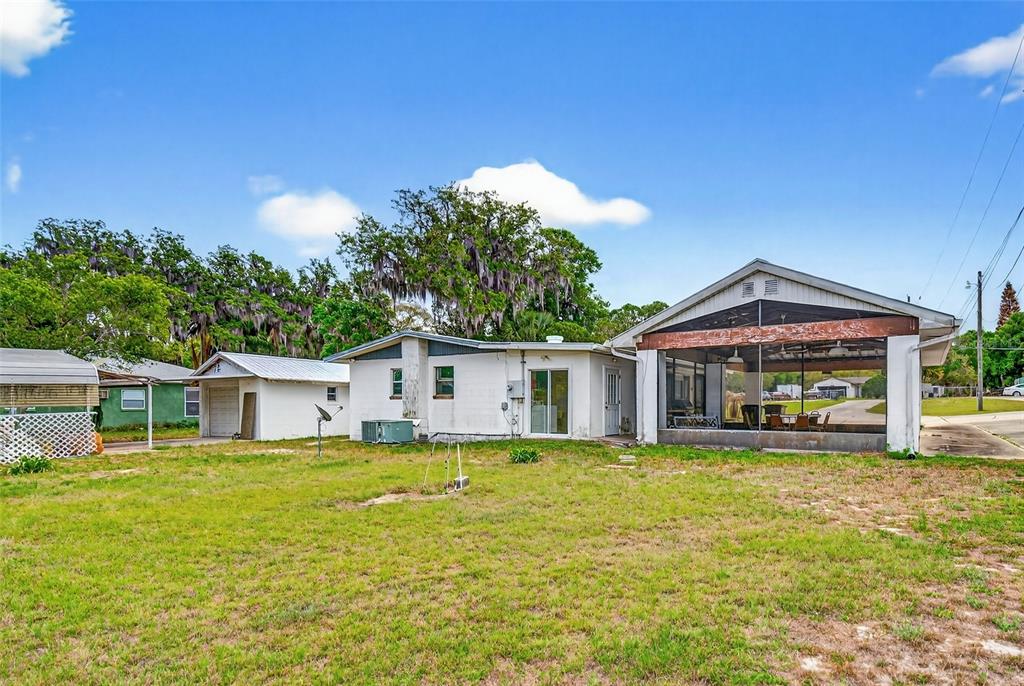 34618 South Haines Creek Road Leesburg, FL 34788 - Photo 8 of 41 a view of a house with a big yard