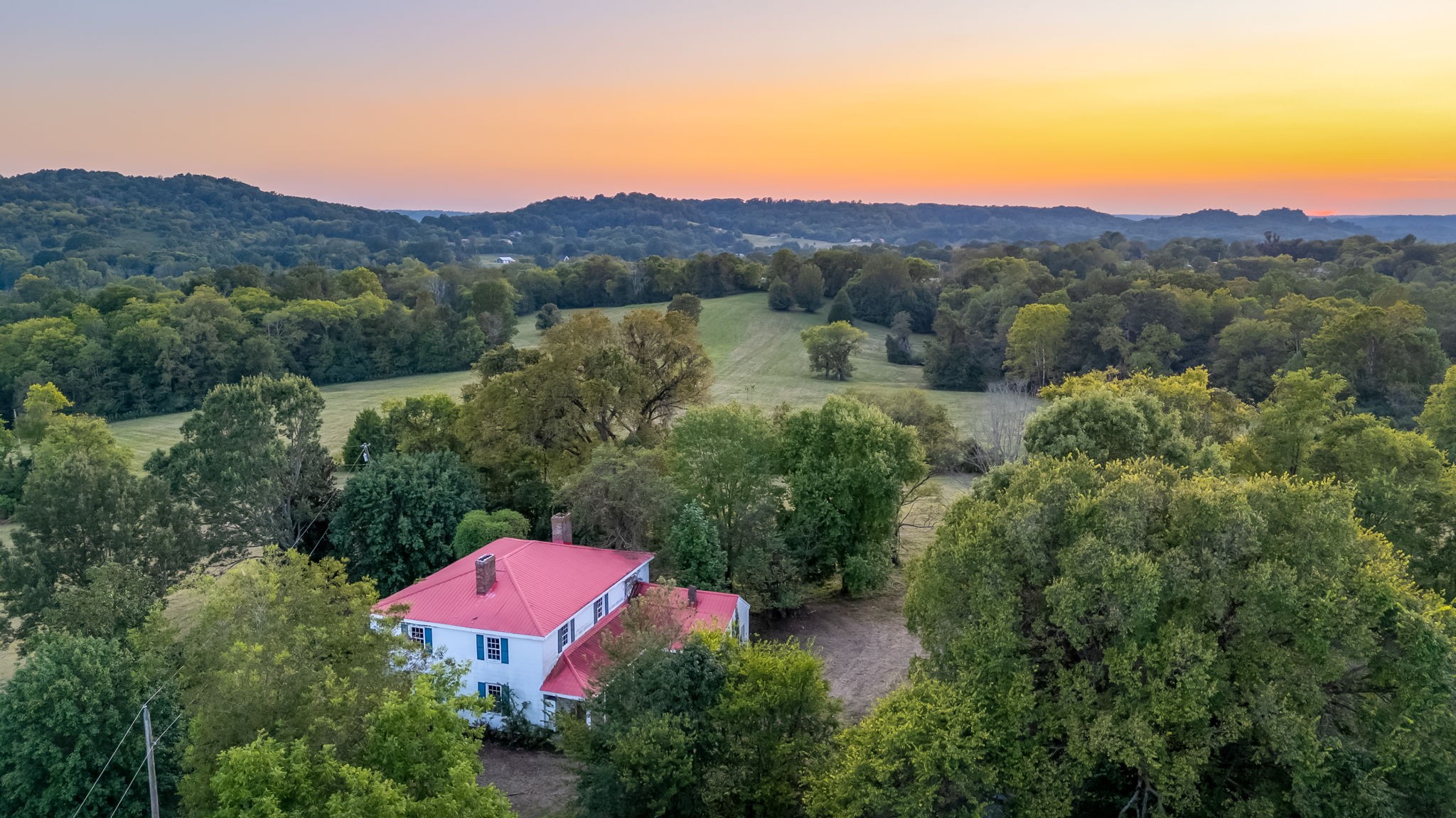 3213 Craig Bridge Road Williamsport, TN 38487 - Photo 13 of 47 a view of a lush green hillside and a houses