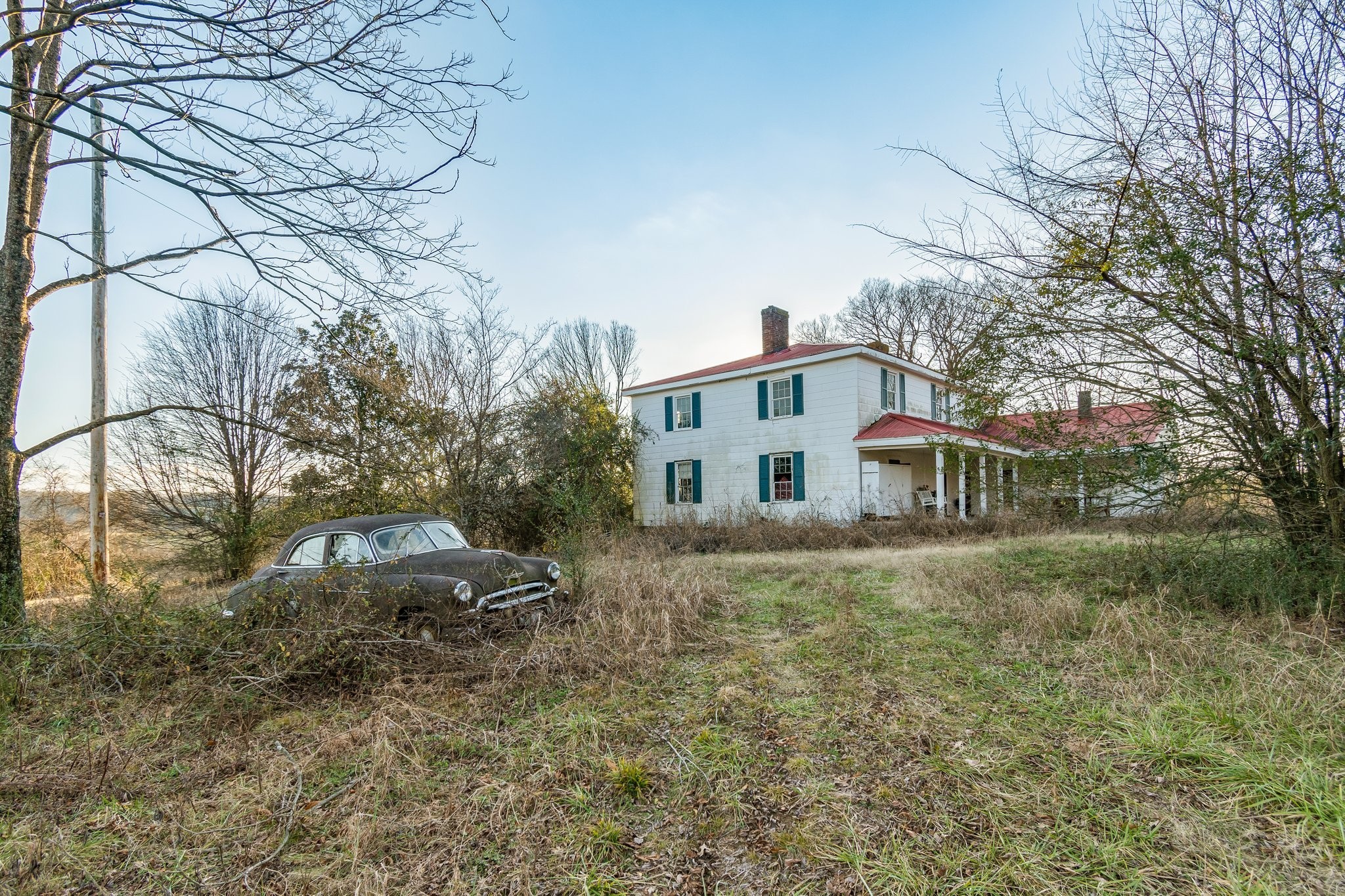 3213 Craig Bridge Road Williamsport, TN 38487 - Photo 17 of 47 a view of a yard in front of a house with large trees