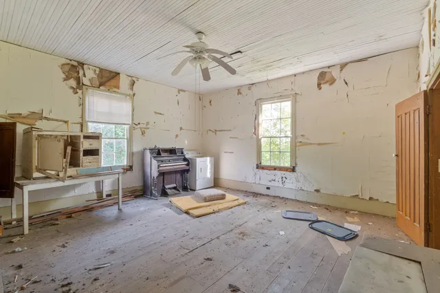 a view of a livingroom with furniture and a fireplace
