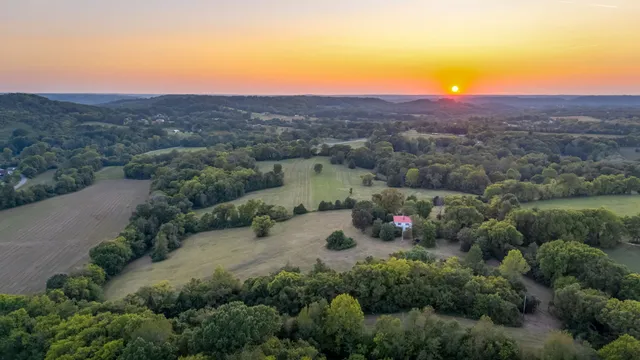 an aerial view of a house with mountain view