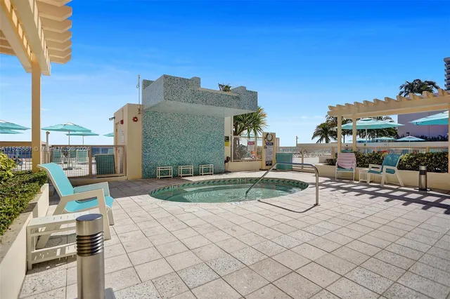 a view of a swimming pool with chairs