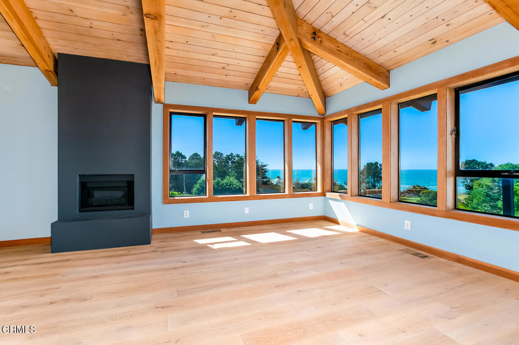 45460 Indian Shoals Road Mendocino, CA 95460 - Photo 20 of 50 a view of an empty room with a fireplace and a window
