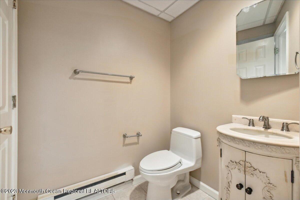 4 Beaver Hill Road Morganville, NJ 07751 - Photo 54 of 71 a bathroom with a sink toilet and a mirror