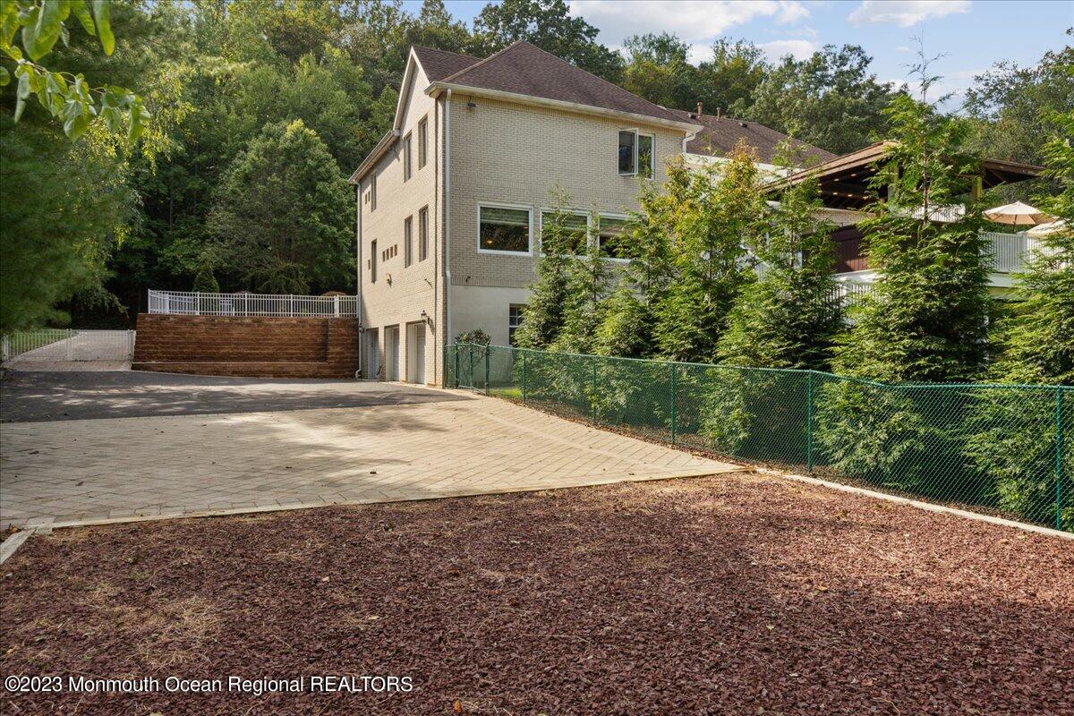 4 Beaver Hill Road Morganville, NJ 07751 - Photo 61 of 71 a backyard of a house with lots of green space