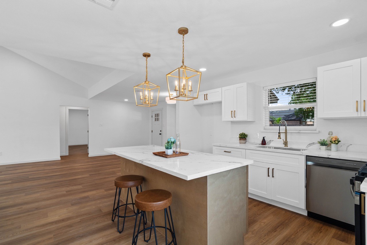 5326 Findlay Drive Pasadena, TX 77505 - Photo 25 of 50 Large kitchen with a large quartz island, shaker-style cabinetry, stainless steel appliances, and an open-concept layout.