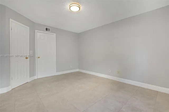 a kitchen with stainless steel appliances a stove a microwave and a refrigerator