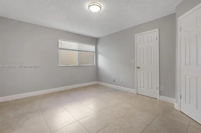a white refrigerator freezer sitting in a kitchen