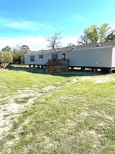 230 Matthew Cove Bastrop, TX 78602 - Photo 1 of 1 a view of a swimming pool and an outdoor seating