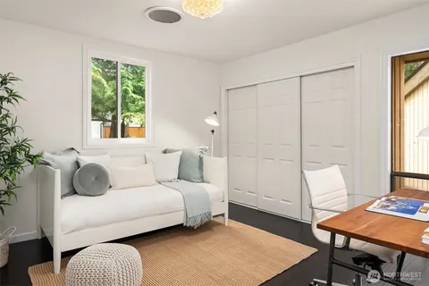 a living room with furniture and a rug