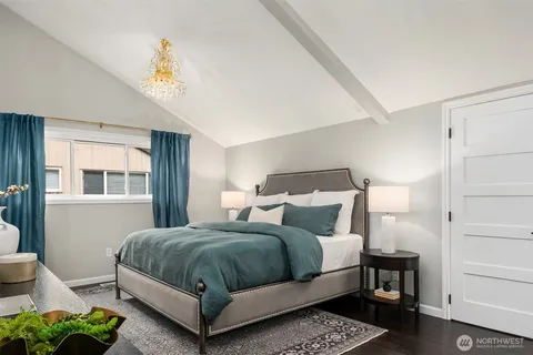 a bedroom with furniture and a window