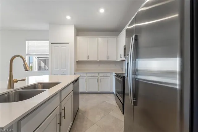 a bedroom with a bed and cabinets