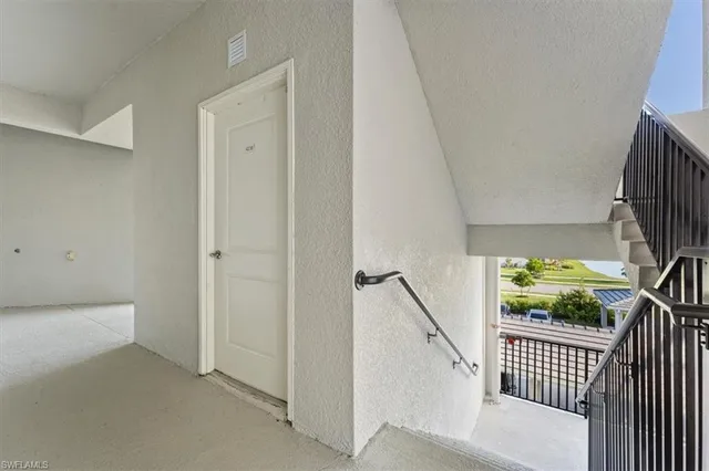 a bedroom with a bed and a potted plant