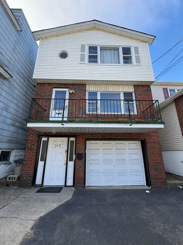a front view of a house with garage