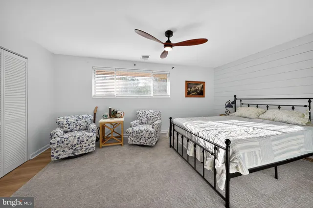 a bedroom with bed and window