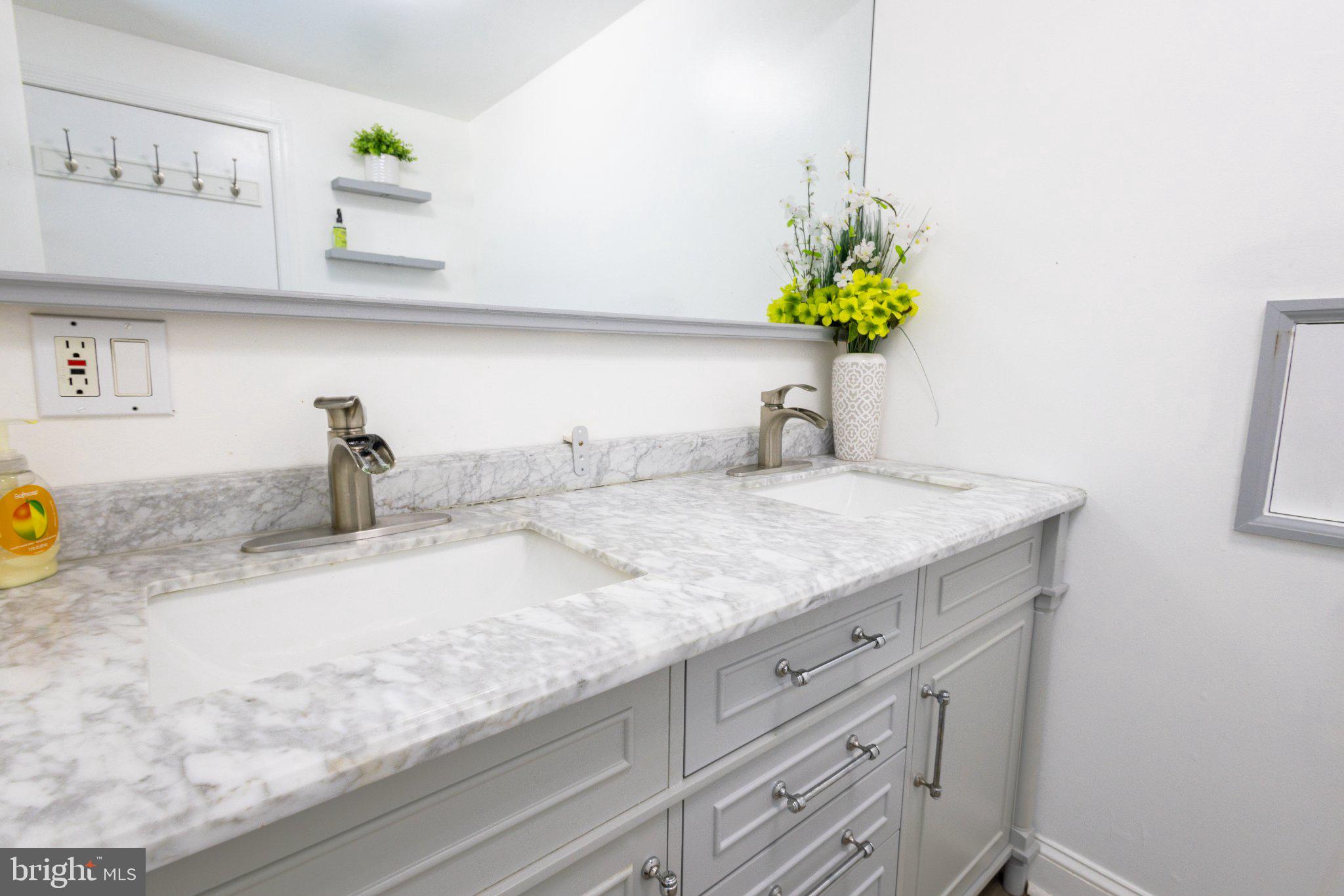 109 Rutgers Avenue Bridgeton, NJ 08302 - Photo 28 of 43 Sleek dual sink vanity in bright space.