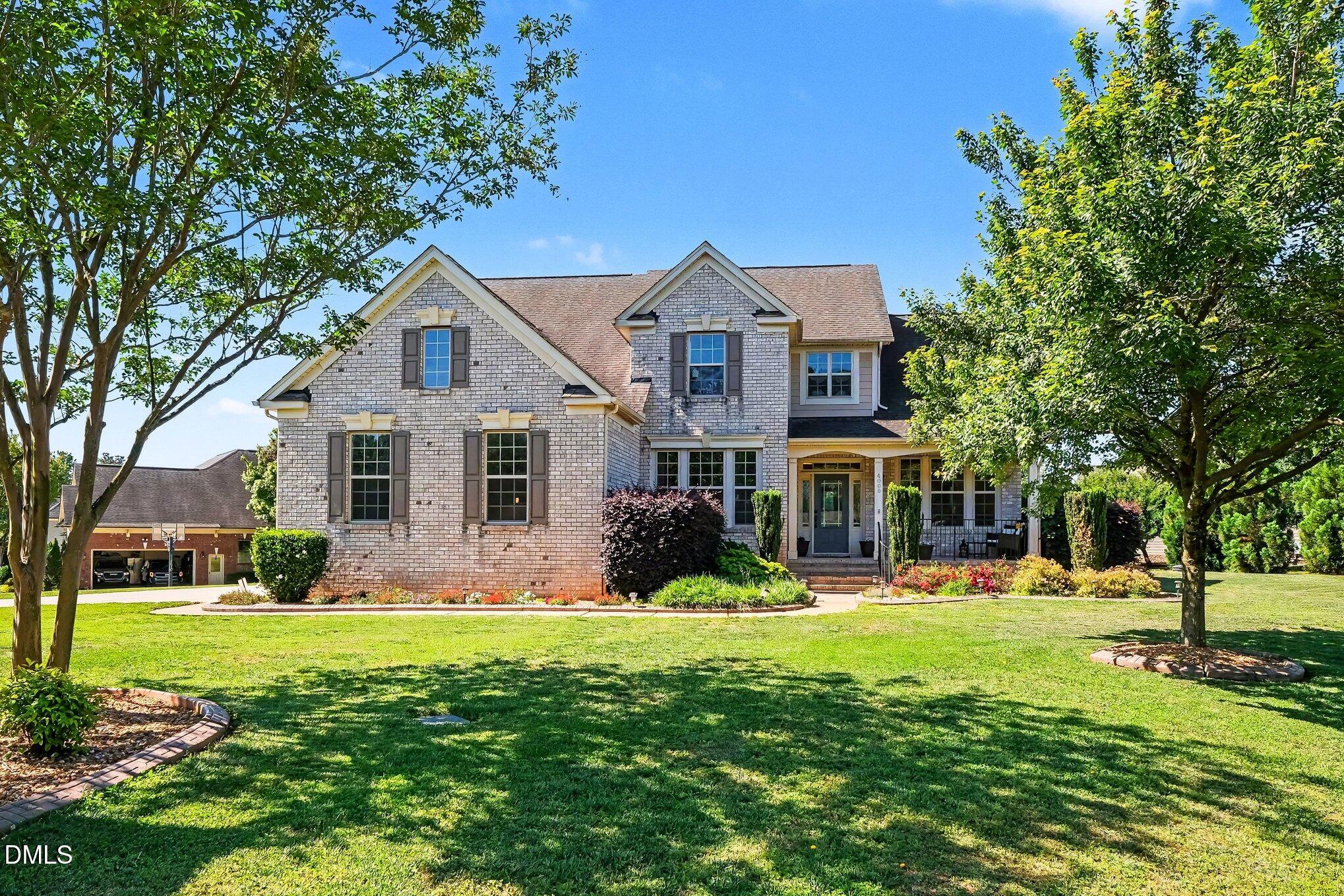 4000 Banks Stone Drive Raleigh, NC 27603 - Photo 3 of 60 a front view of a house with yard and green space