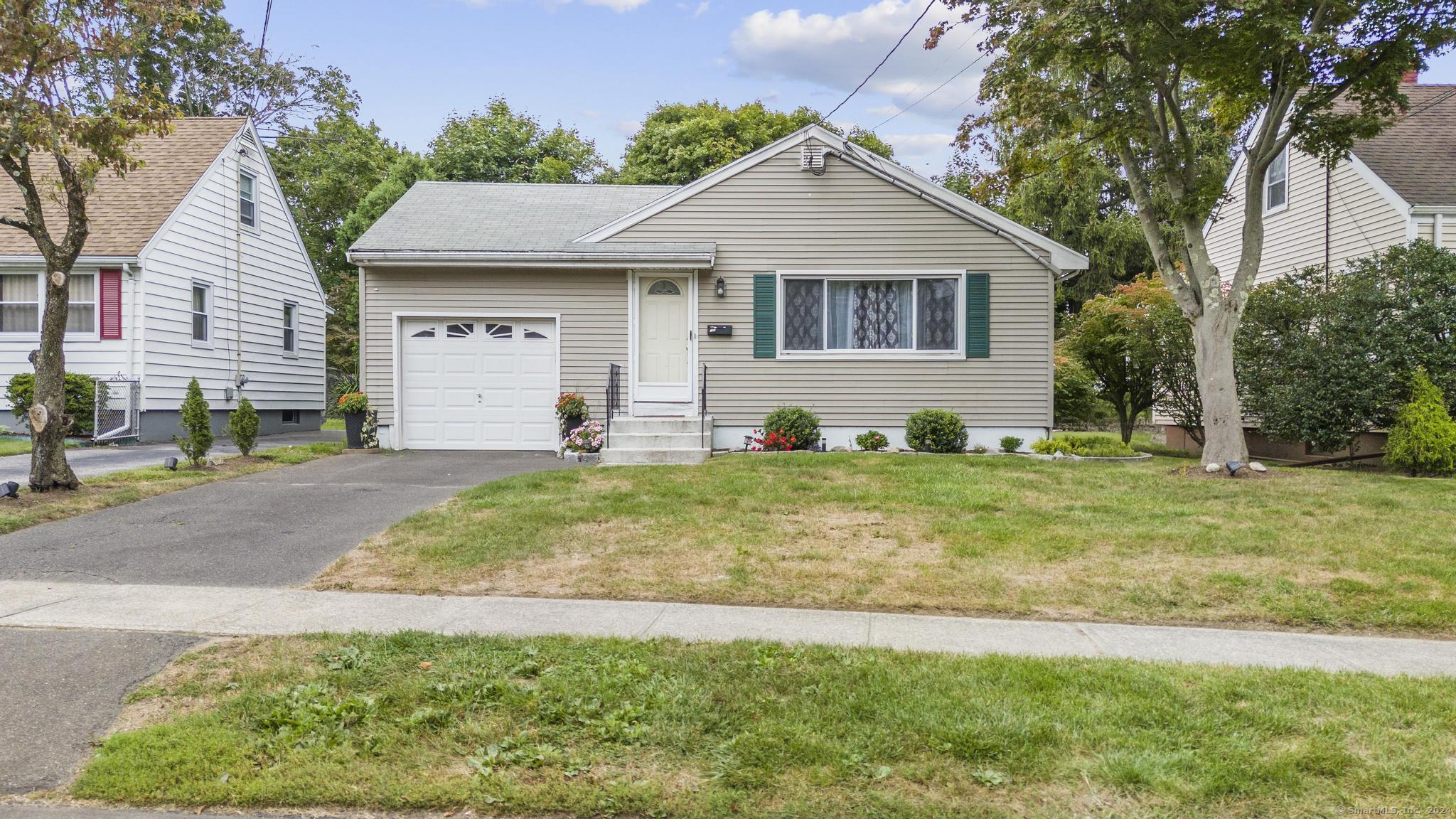 175 Legion Avenue Stratford, CT 06614 - Photo 1 of 1 a front view of a house with garden