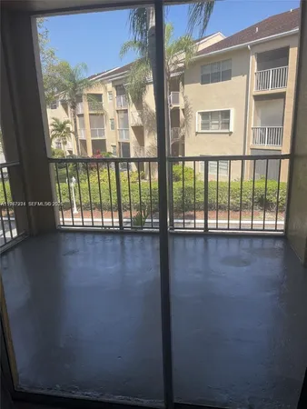 a view of a room with a large window
