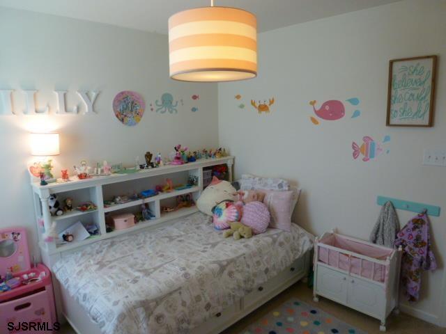 218 Surf Road Egg Harbor Township, NJ 08234 - Photo 17 of 28 a bedroom with a bed and a dresser